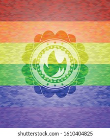 fire icon inside emblem on mosaic background with the colors of the LGBT flag