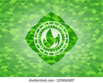 fire icon inside green emblem with mosaic ecological style background