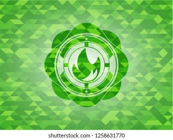 fire icon inside green emblem with mosaic ecological style background
