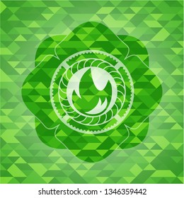 fire icon inside green emblem with triangle mosaic background