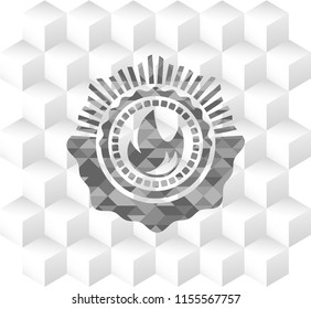 fire icon inside grey badge with geometric cube white background
