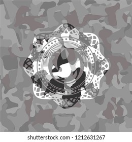 fire icon inside grey camo emblem