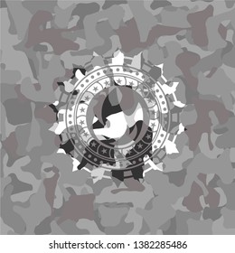 fire icon inside grey camouflage emblem