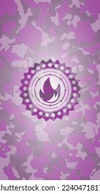 fire icon inside pink camouflaged emblem. 