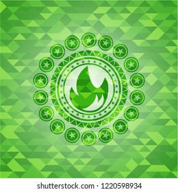 fire icon inside realistic green emblem. Mosaic background