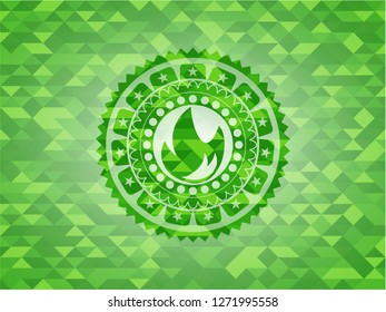 fire icon inside realistic green mosaic emblem