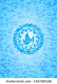 fire icon inside realistic light blue emblem. Mosaic background