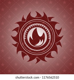 fire icon inside red emblem