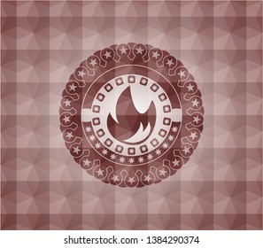 fire icon inside red seamless emblem with geometric pattern background.