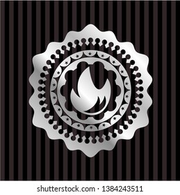 fire icon inside silvery badge or emblem