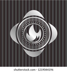 fire icon inside silvery emblem