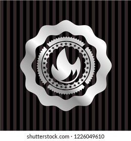 fire icon inside silvery emblem or badge