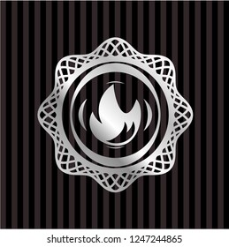 fire icon inside silvery emblem or badge