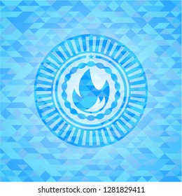 fire icon inside sky blue emblem. Mosaic background