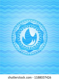 fire icon inside water concept badge.