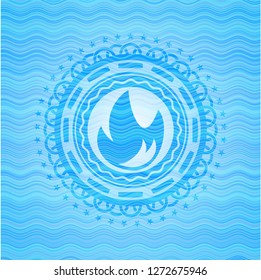 fire icon inside water concept emblem.