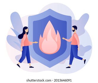 Fire prevention technologies. Tiny people with big shield as metaphor of fire protection. Firefighter rescuer. Modern flat cartoon style. Vector illustration on white background