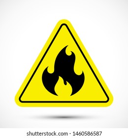 Fire risk warning sign. Black flame symbol on yellow triangle isolated on white background. Simple icon vector illustration.