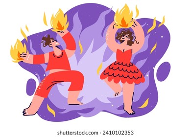 Fire show from man and woman dancing rhythmically to music with flame in hands, dressed in stage clothes. Passionate couple performs fire show for spectators during circus entertainment event