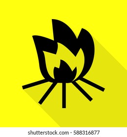 Fire sign. Black icon with flat style shadow path on yellow background.