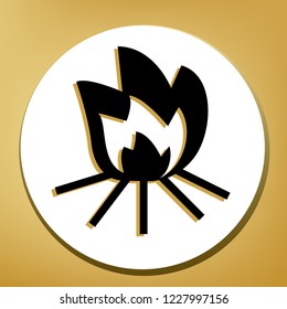 Fire sign. Vector. Black icon with light brown shadow in white circle with shaped ring at golden background.
