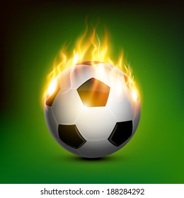 fire soccer ball burning with green background