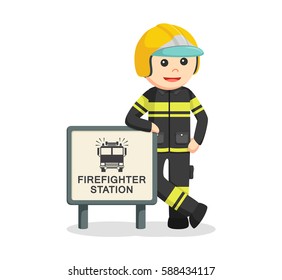 fireman with firefighter station sign