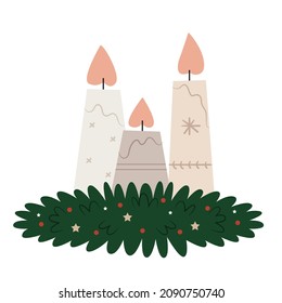 Fireplace decor from Christmas candles. A wreath of their Christmas tree branches. Scandinavian style.