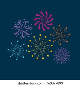 fireworks bursting in glowing multi colours on dark blue background
