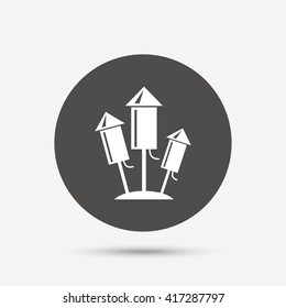 Fireworks rockets sign icon. Explosive pyrotechnic device symbol. Gray circle button with icon. Vector