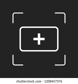 First aid box. simple icon. White object in camera autofocus on dark background