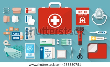 First aid kit box with medical equipment and medications for emergency, objects top view
