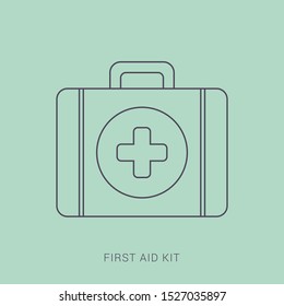 First aid kit isolated on green background