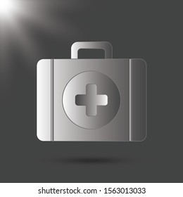 First aid kit isolated on gray background