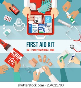 First aid kit with medications and emergency equipment and medical team hands
