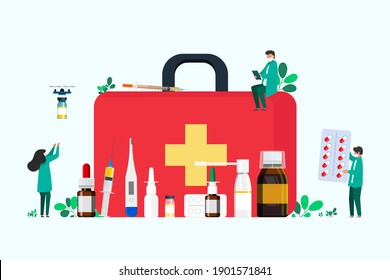 first aid kit with medicines for the throat, cold remedy, thermometer, tablets, syringe for injection. people collect medicine in first aid kit