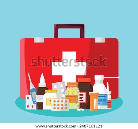 First aid kit with pills and drugs flat vector illustration isolated on blue background.