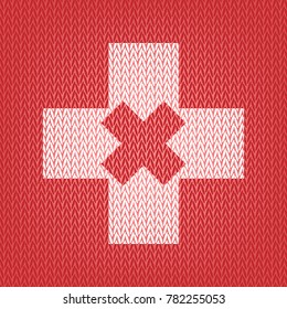 First aid sign illustration. Vector. Knitted white icon on a red knitted background.