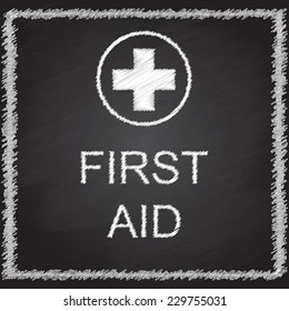 FIRST AID sign on blackboard