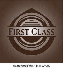 First Class badge with wooden background