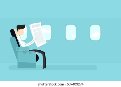 First class plane seat. Businessman reading newspaper.