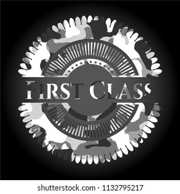 First Class written on a grey camouflage texture