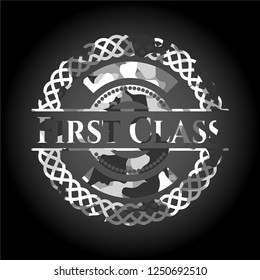 First Class written on a grey camouflage texture