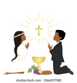 First holy communion sacrament. Small latin boy and girl praying on knees.