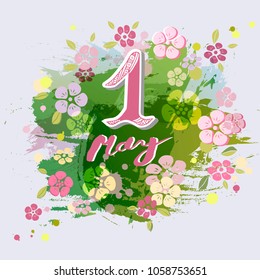 First of May text isolated on background with flowers. Template for International Labor Day, invitation, greeting card, web, postcard.