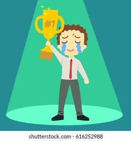 First winner a boy holding trophy crying feeling emotional