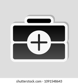first-aid kit, simple icon. Sticker style with white border and simple shadow on gray background