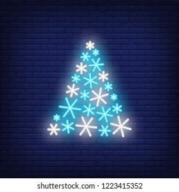 Fir-tree made of snowflakes neon sign. Christmas party advertisement design. Night bright neon sign, colorful billboard, light banner. Vector illustration in neon style.