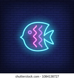 Fish neon sign. Colorful clown fish with bright wave lines. Night bright advertisement. Vector illustration in neon style for aquatic animal and sea life