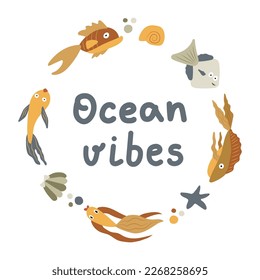 Fish, pebbles, starfish and shells laid out in a circle with the text Ocean vibes. Marine and ocean life